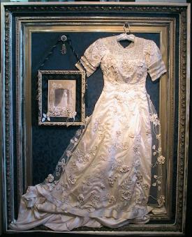 Restored, 100 year old wedding dress at the Museum of the North Beach